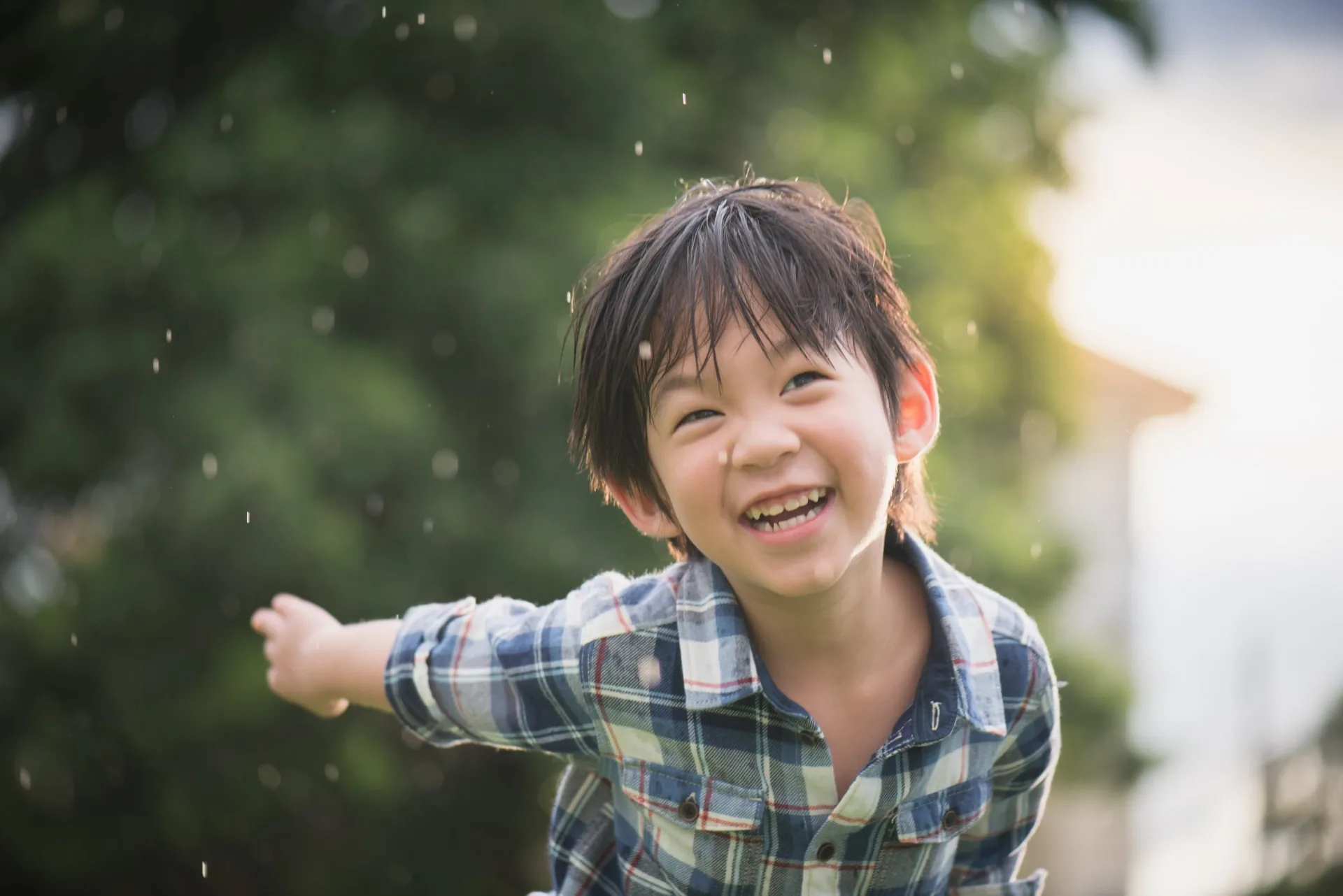 Smiling young boy playing outdoors