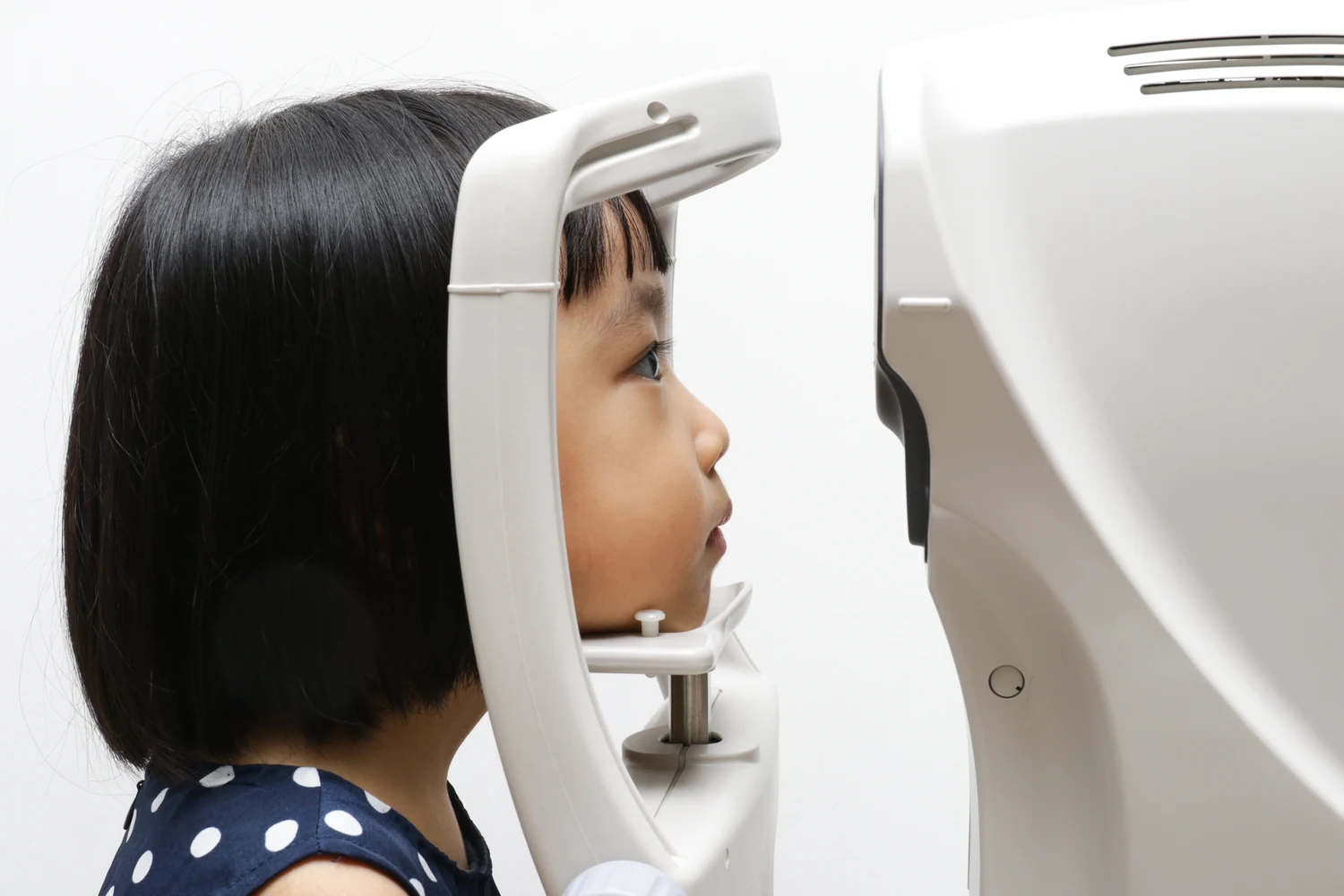 Child having eyes tested for myopia